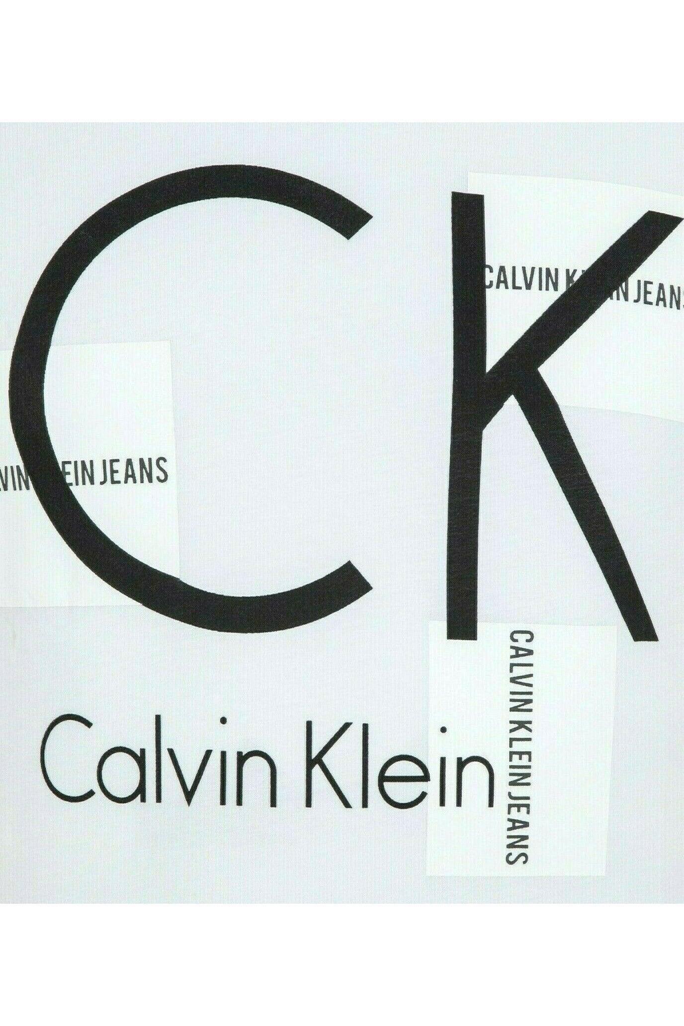 White Calvin Klein Jeans shirt with large black CK logo and text accents